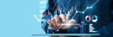 Icons of charts above a person holding a tablet in their hand