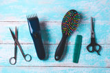 Image of hair cutting equipment over blue background