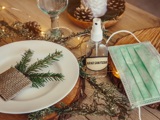 Holiday Table With Hand Sanitizer And Mask
