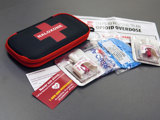 Naloxone kit and contents on a table top.