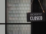 Sorry we are closed sign hanging from door
