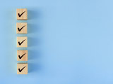 There are five blocks with check marks. - stock photo