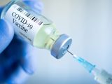 Vaccine bottle and needle
